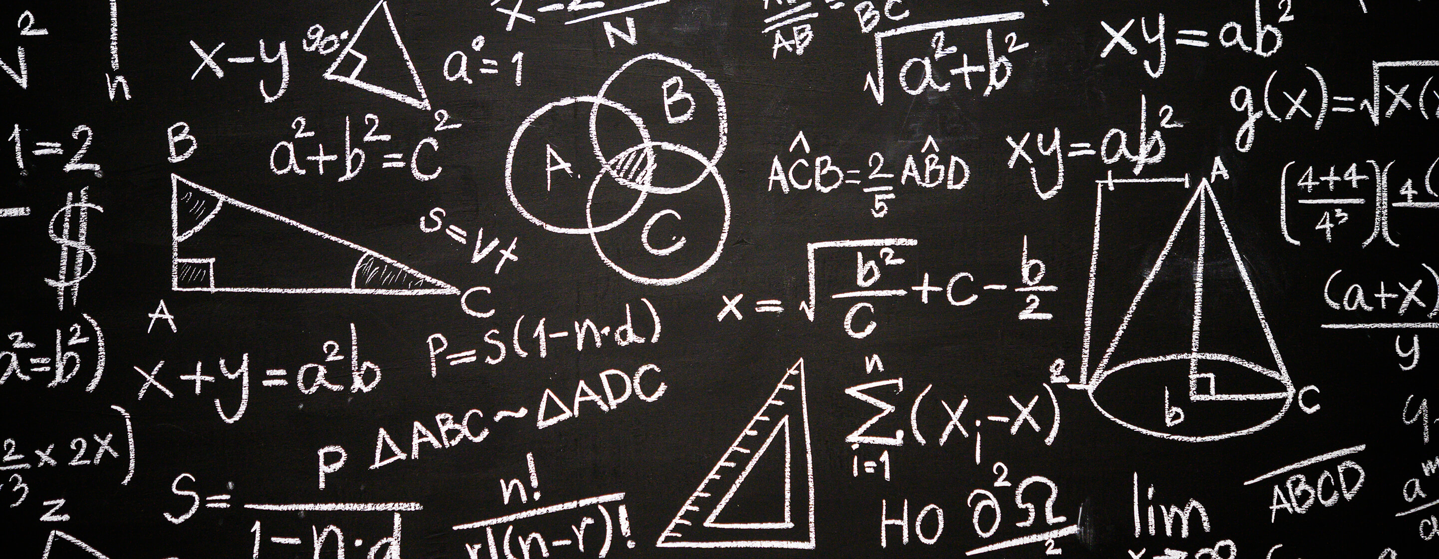 A level Maths written in chalk on a blackboard
